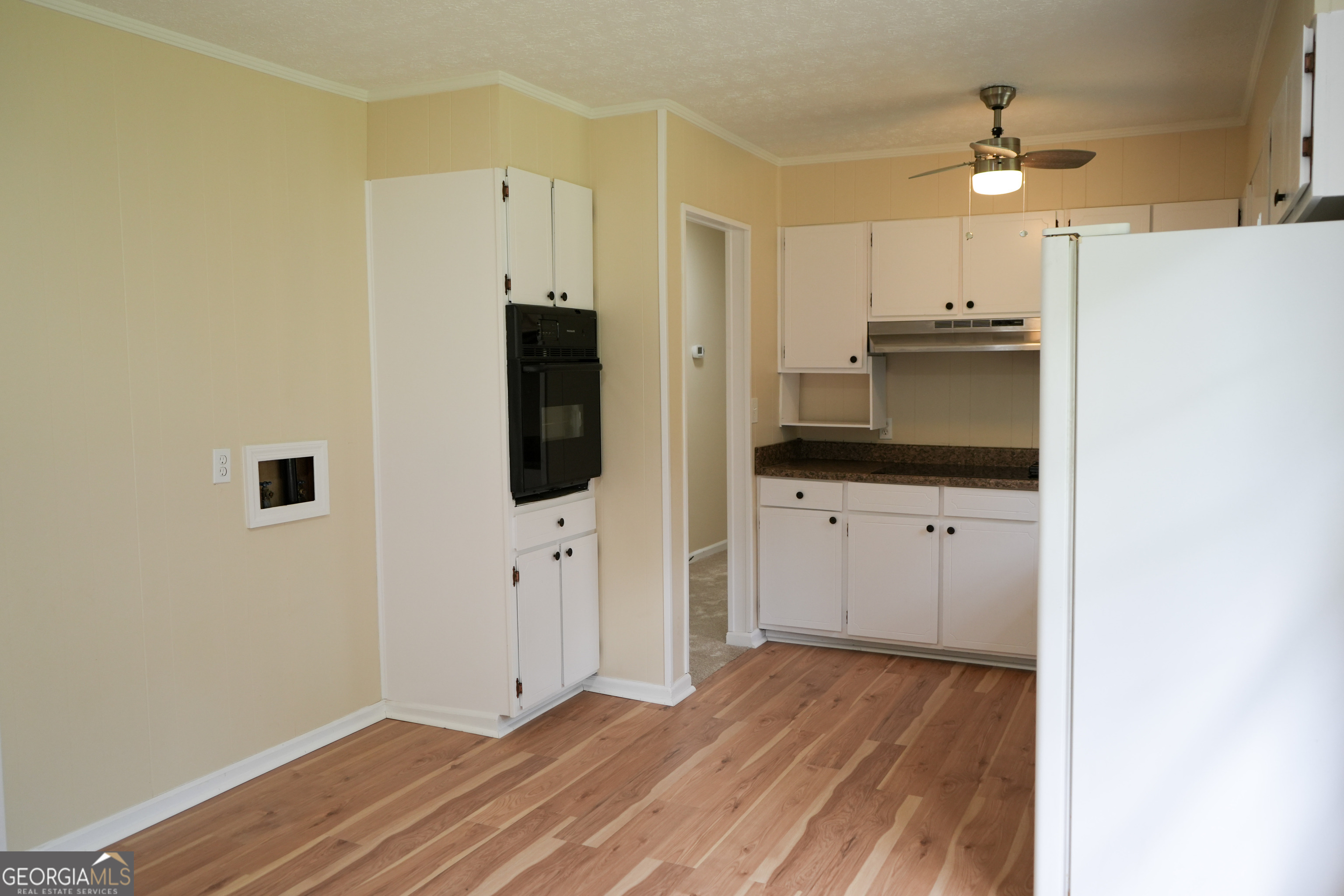 1869 Minter Blue Springs Road Rockledge, GA 30454 - Photo 23 of 45 a view of a kitchen with microwave and refrigerator