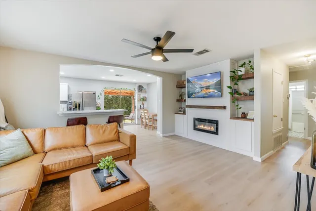 a living room with furniture and a fireplace