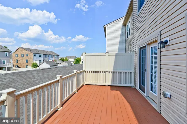 a view of balcony with wooden floor