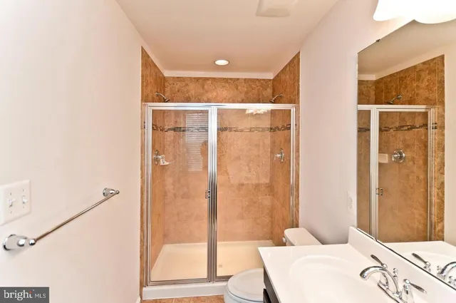 a bathroom with a bathtub and shower