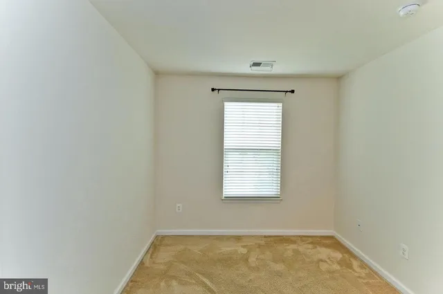 a view of a room that has a window in it