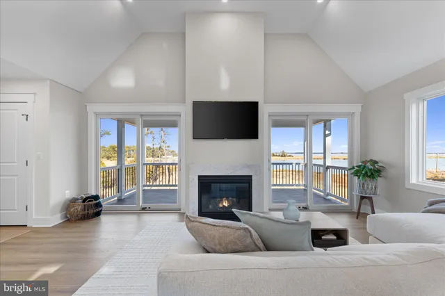 a kitchen with a table chairs refrigerator and microwave
