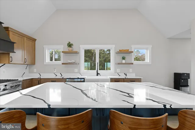 a kitchen with a stove a sink and a refrigerator