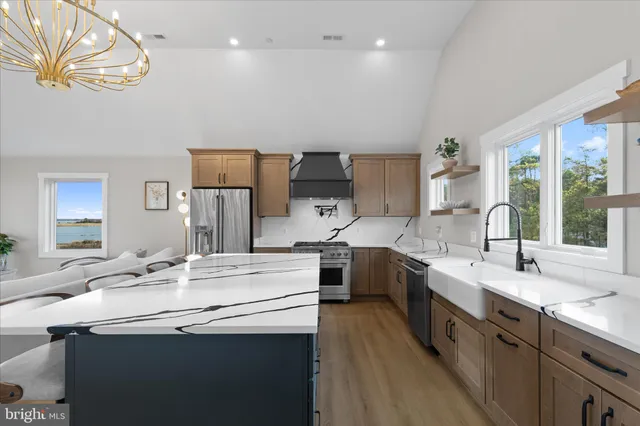 a bedroom with a large bed and a ceiling fan