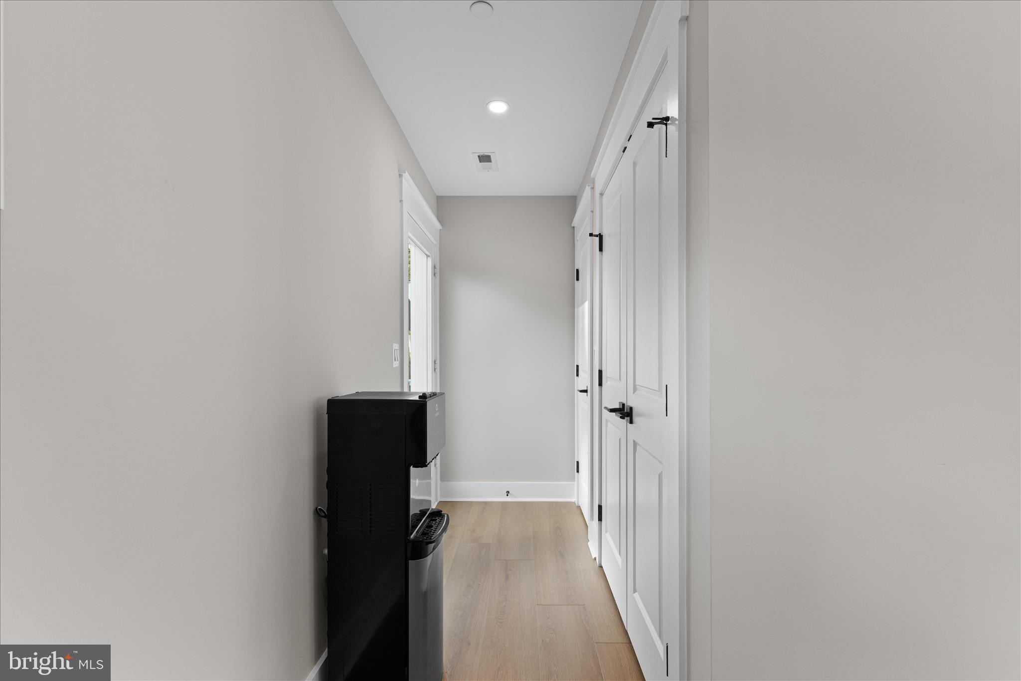 16242 Thomas Road Piney Point, MD 20674 - Photo 42 of 75 a view of a hallway with wooden shelves