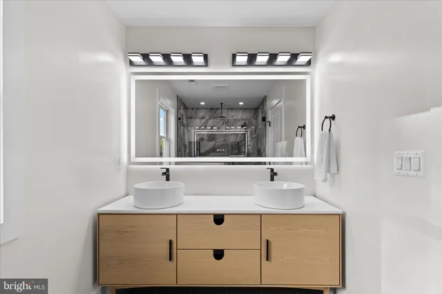 a view of a house with a yard and potted plants