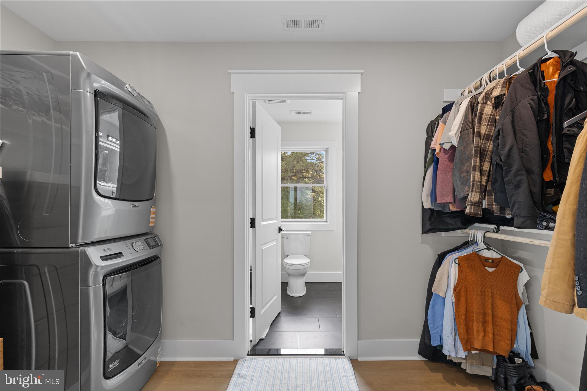 16242 Thomas Road Piney Point, MD 20674 - Photo 50 of 75 a view of walk in closet with clothes and shoes