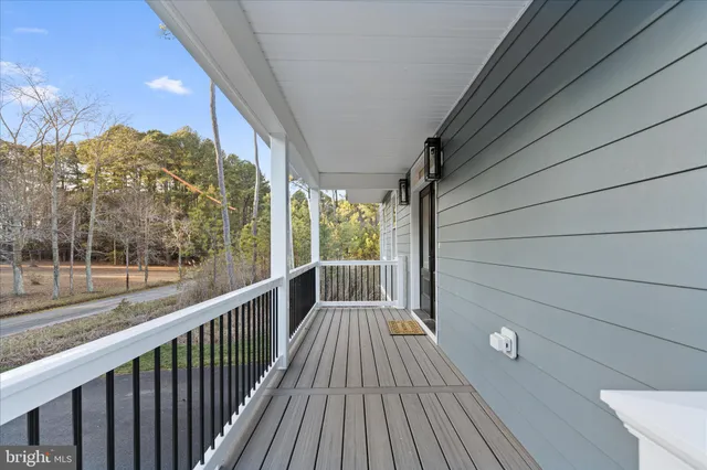 a view of balcony with wooden floor