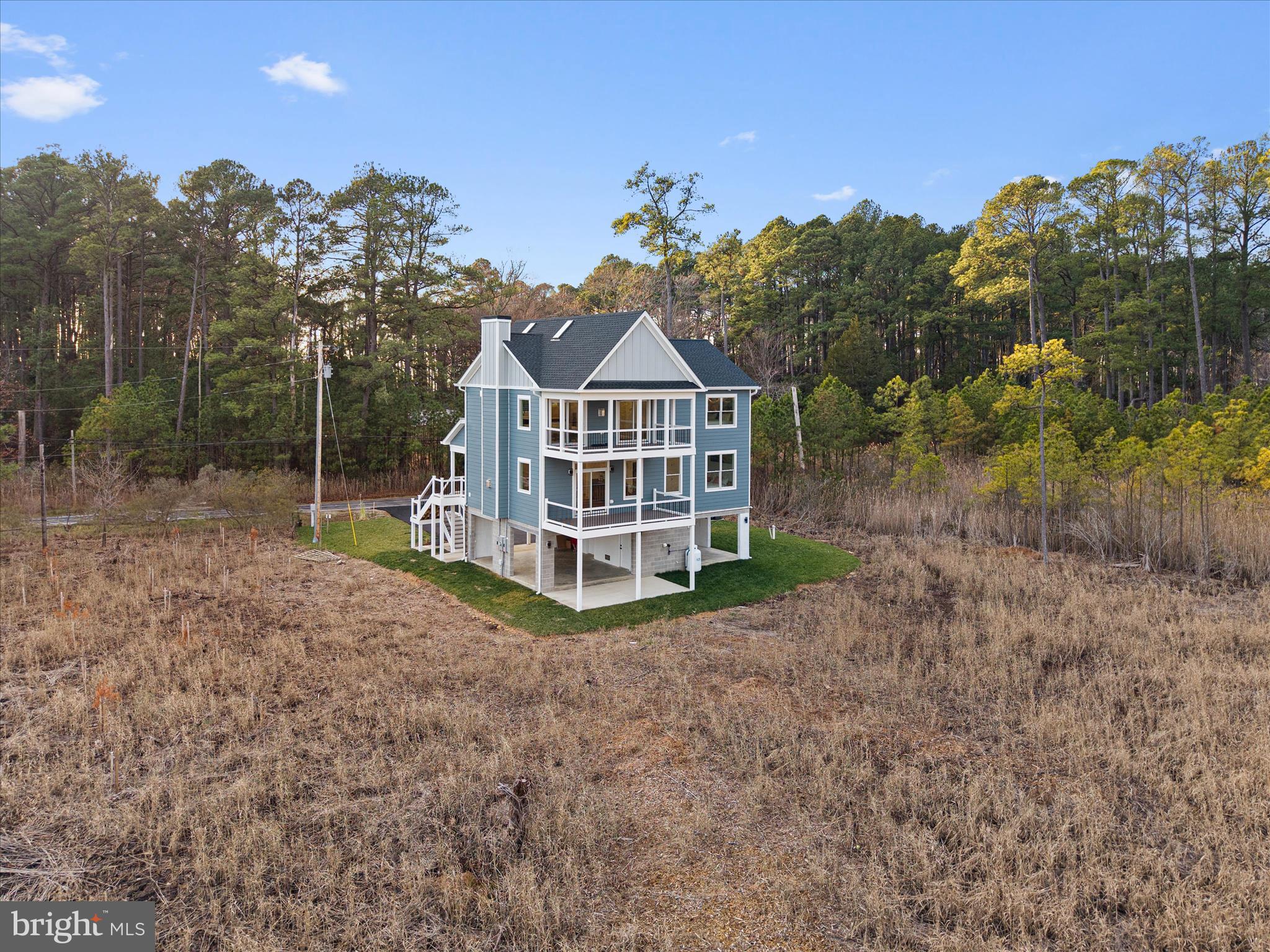 16242 Thomas Road Piney Point, MD 20674 - Photo 56 of 75 a view of a house with a yard and potted plants