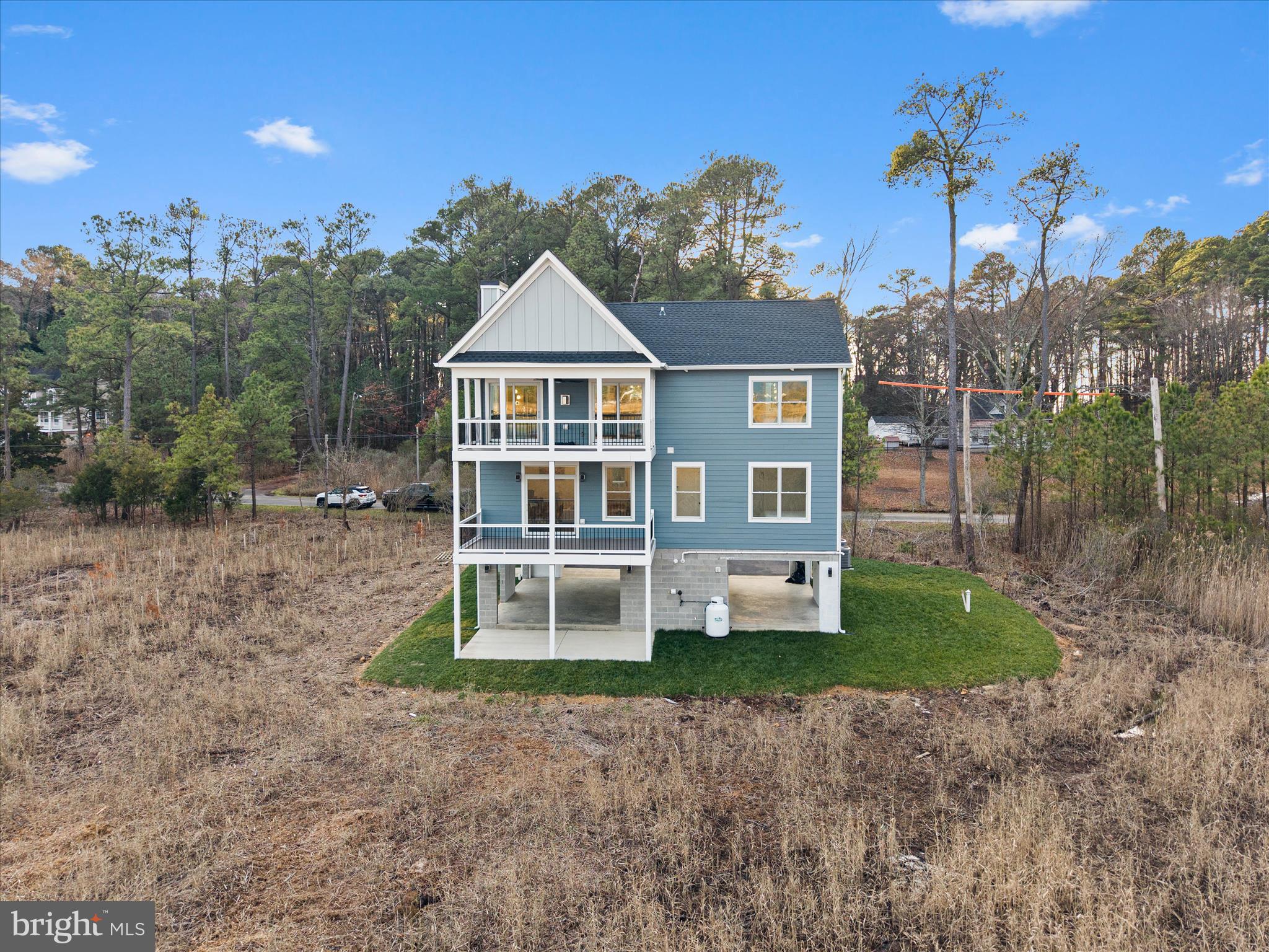 16242 Thomas Road Piney Point, MD 20674 - Photo 57 of 75 a front view of a house with a yard