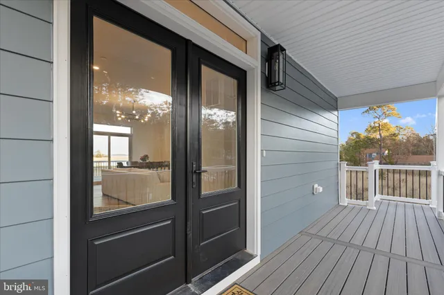 a view of a balcony with wooden floor