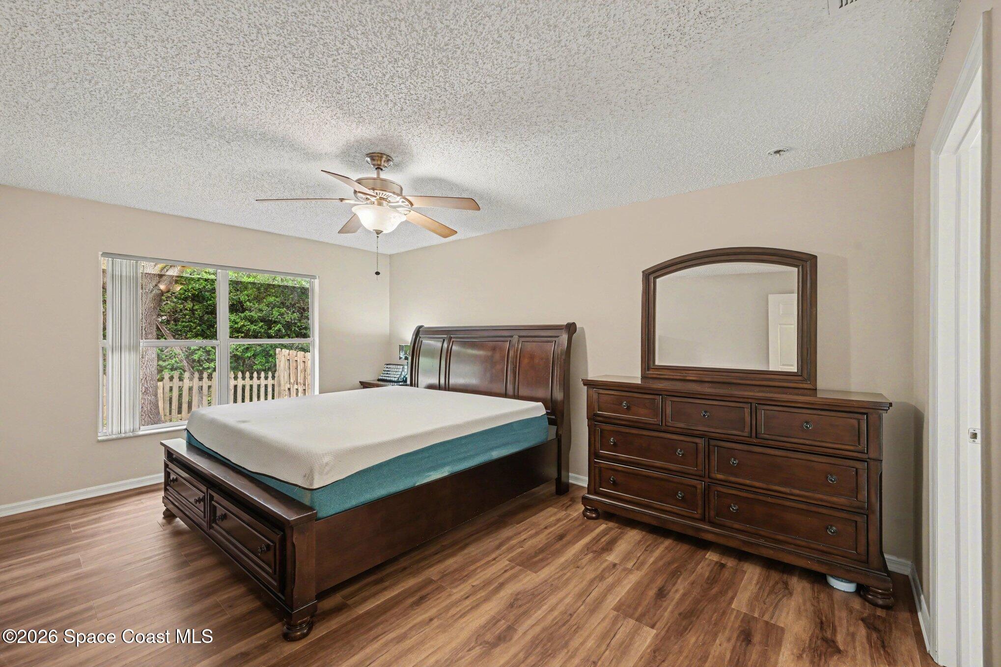 558 Barber Street Sebastian, FL 32958 - Photo 14 of 25 a bedroom with a bed and window