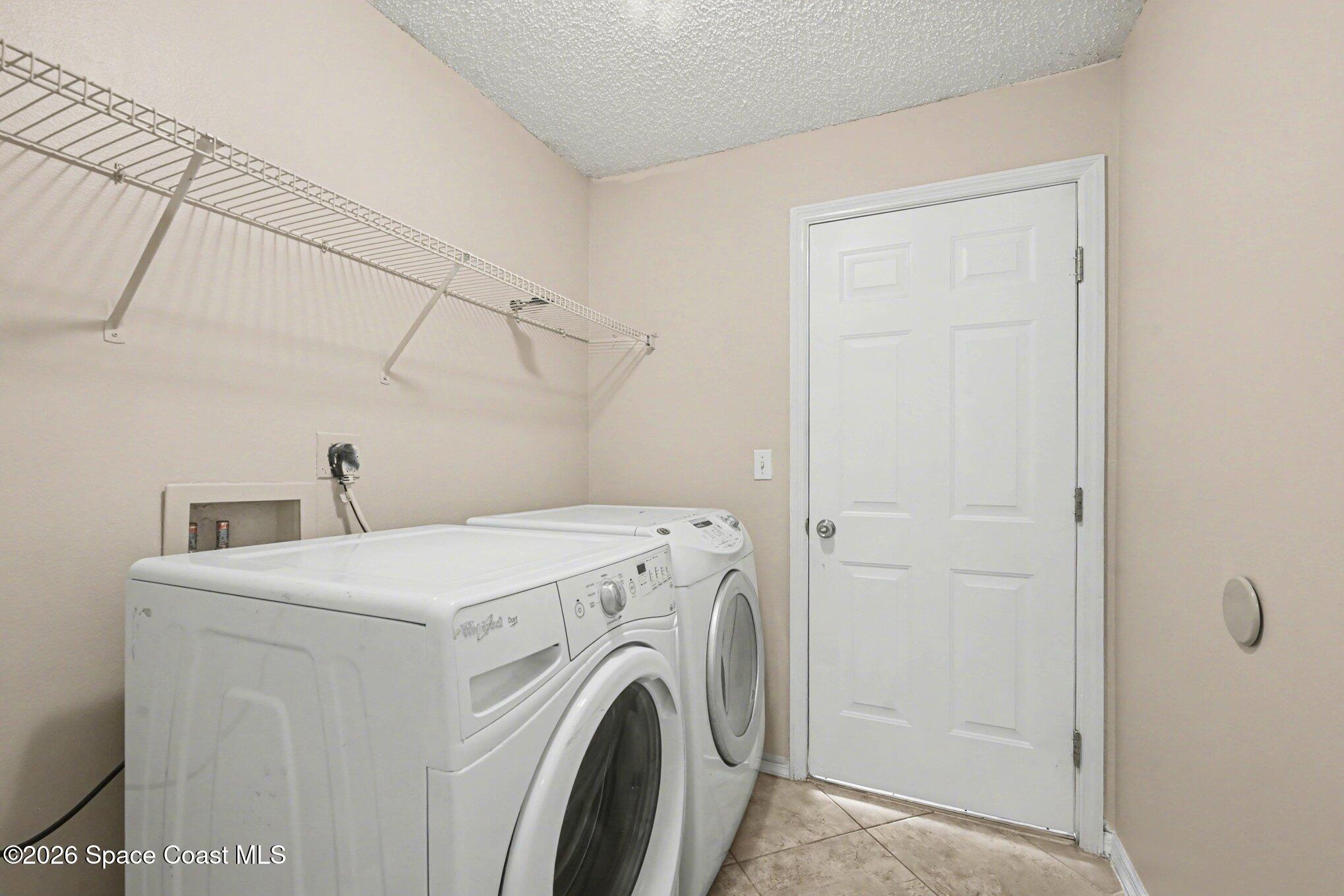 558 Barber Street Sebastian, FL 32958 - Photo 23 of 25 a utility room with dryer and washer