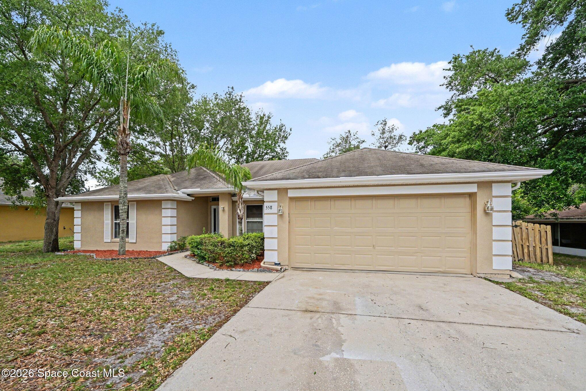 558 Barber Street Sebastian, FL 32958 - Photo 3 of 25 front view of a house with a yard