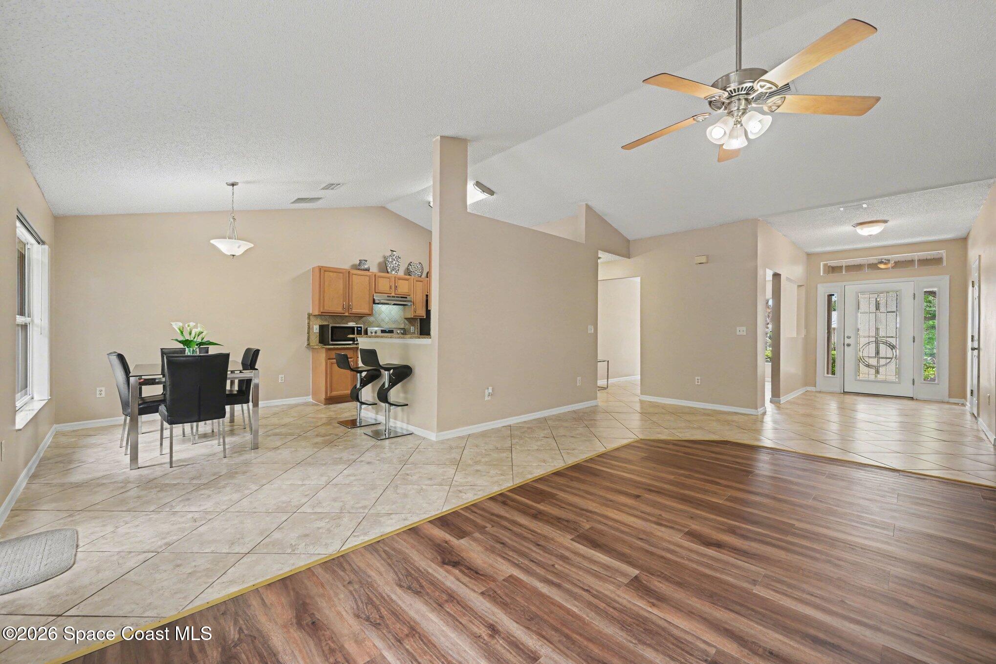 558 Barber Street Sebastian, FL 32958 - Photo 5 of 25 a view of a livingroom with furniture and a workspace