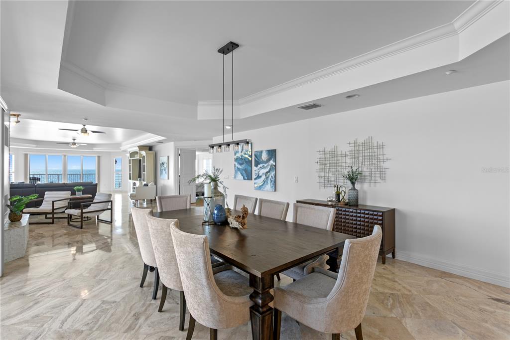 19730 Gulf Boulevard, Unit 400 Indian Rocks Beach, FL 33785 - Photo 5 of 90 a view of a dining room with furniture window and wooden floor