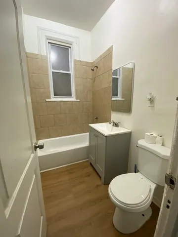 a bathroom with a toilet a sink and bathtub