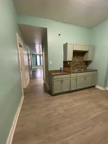 a view of a kitchen from the hallway