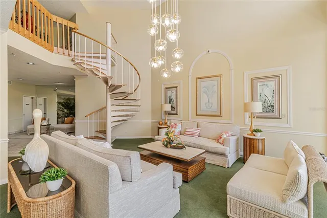 a living room with furniture a chandelier and a window