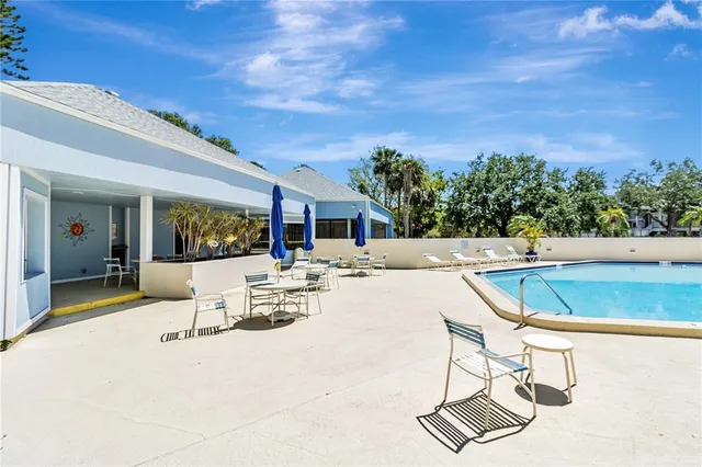 a view of a lake with houses in the back
