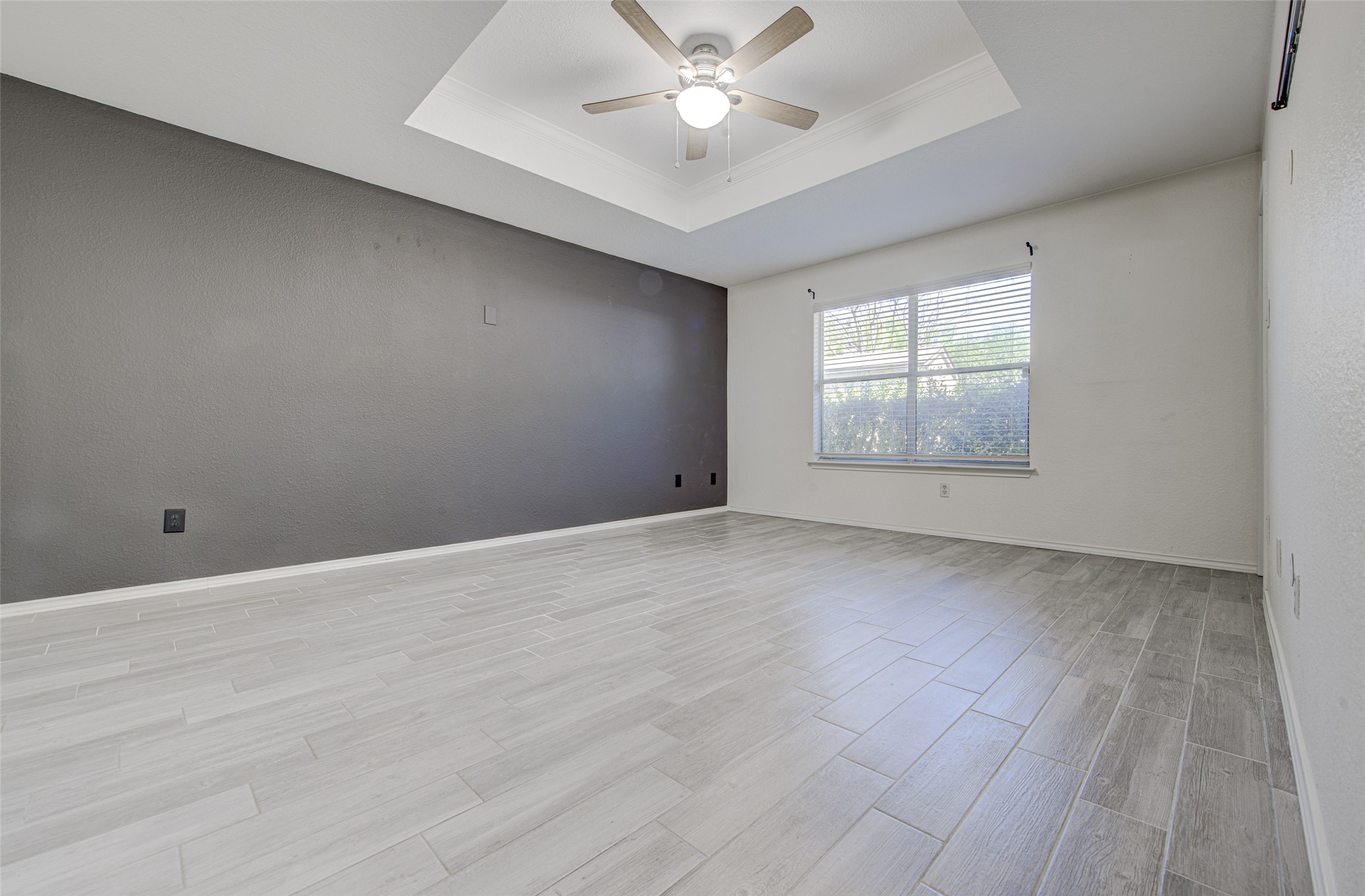 5908 Krinan Court Austin, TX 78754 - Photo 19 of 31 wooden floor in an empty room with a window