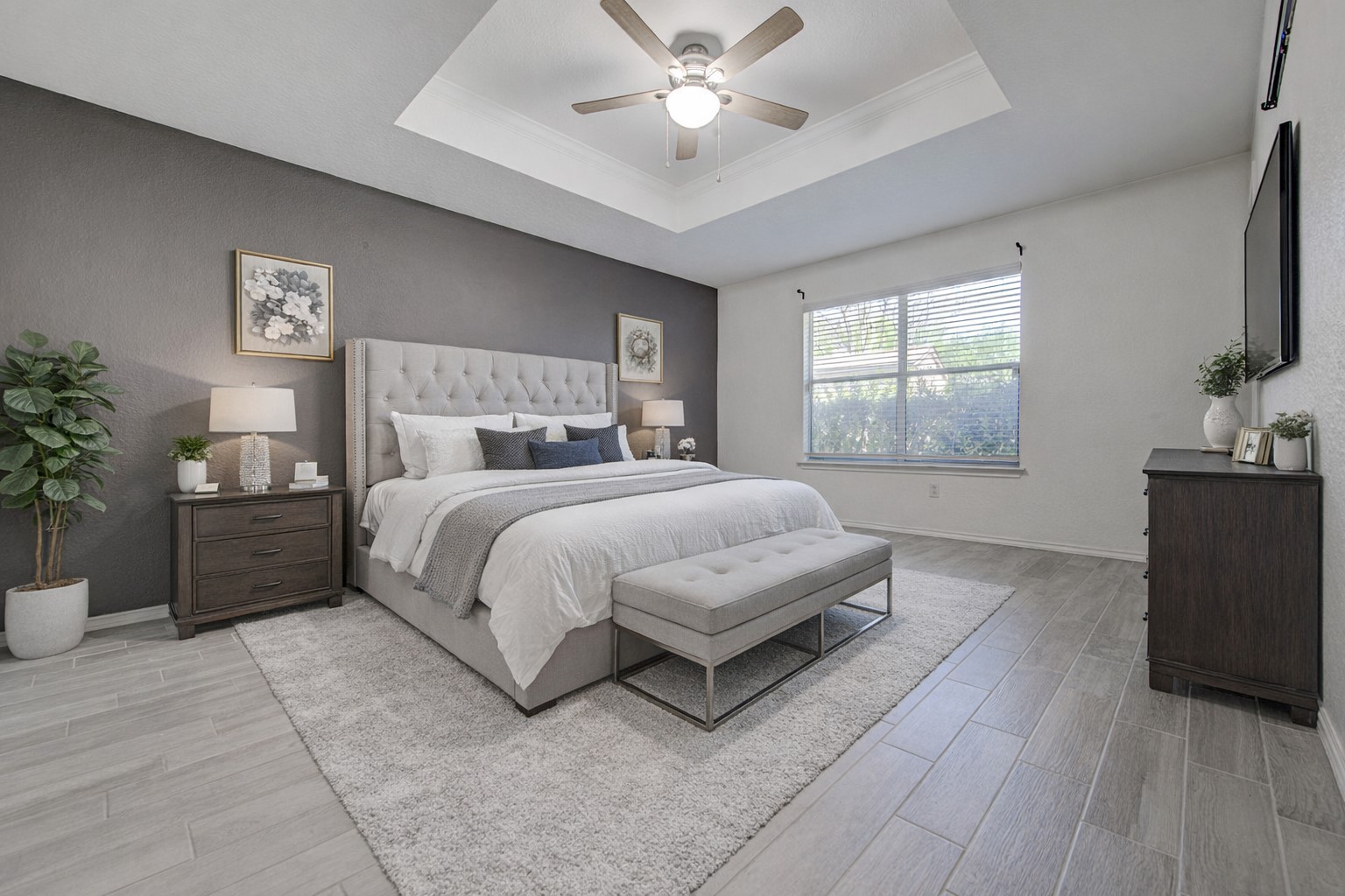 5908 Krinan Court Austin, TX 78754 - Photo 20 of 31 a bedroom with a large bed and a chandelier fan