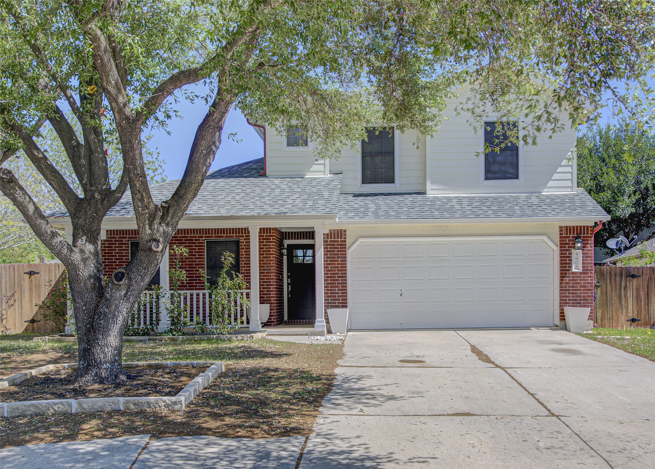 5908 Krinan Court Austin, TX 78754 - Photo 2 of 31 a front view of a house with a tree