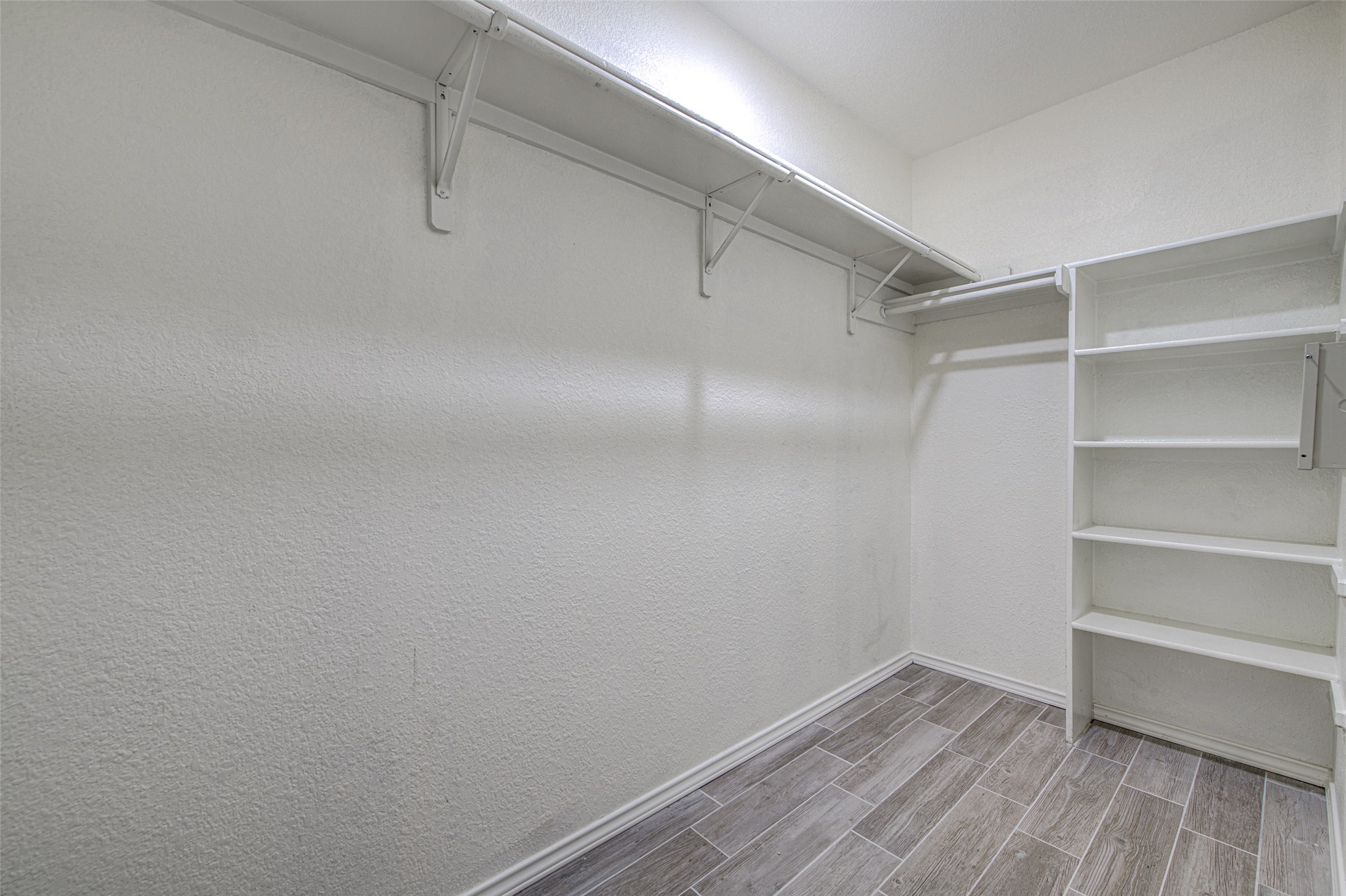 5908 Krinan Court Austin, TX 78754 - Photo 23 of 31 a view of an empty walk in closet