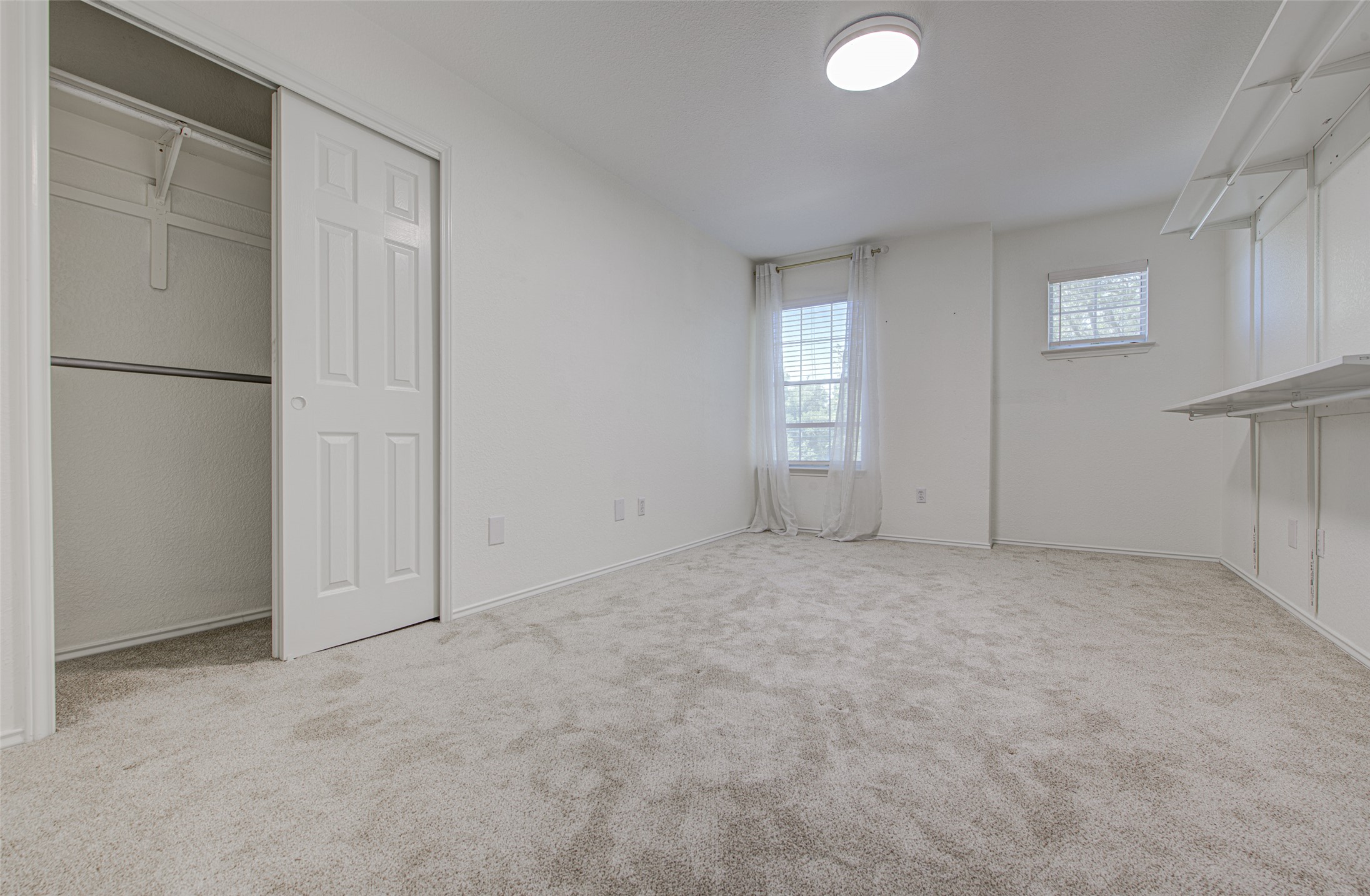 5908 Krinan Court Austin, TX 78754 - Photo 27 of 31 an empty room with windows and closet
