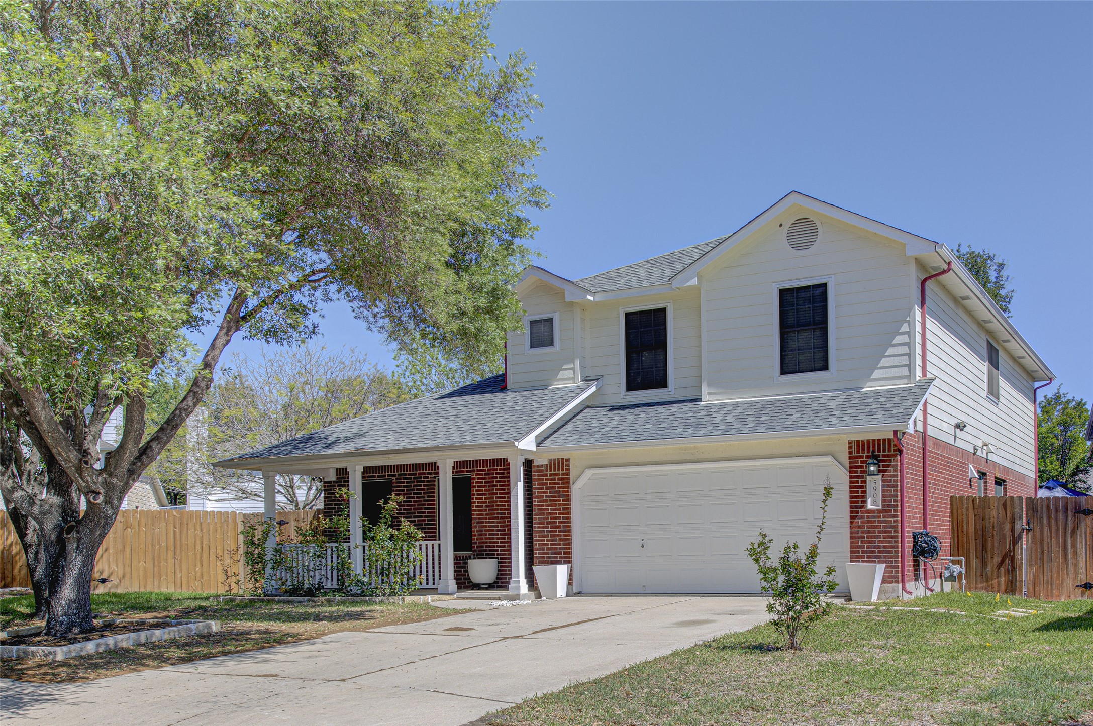 5908 Krinan Court Austin, TX 78754 - Photo 3 of 31 a front view of a house with a yard and garage