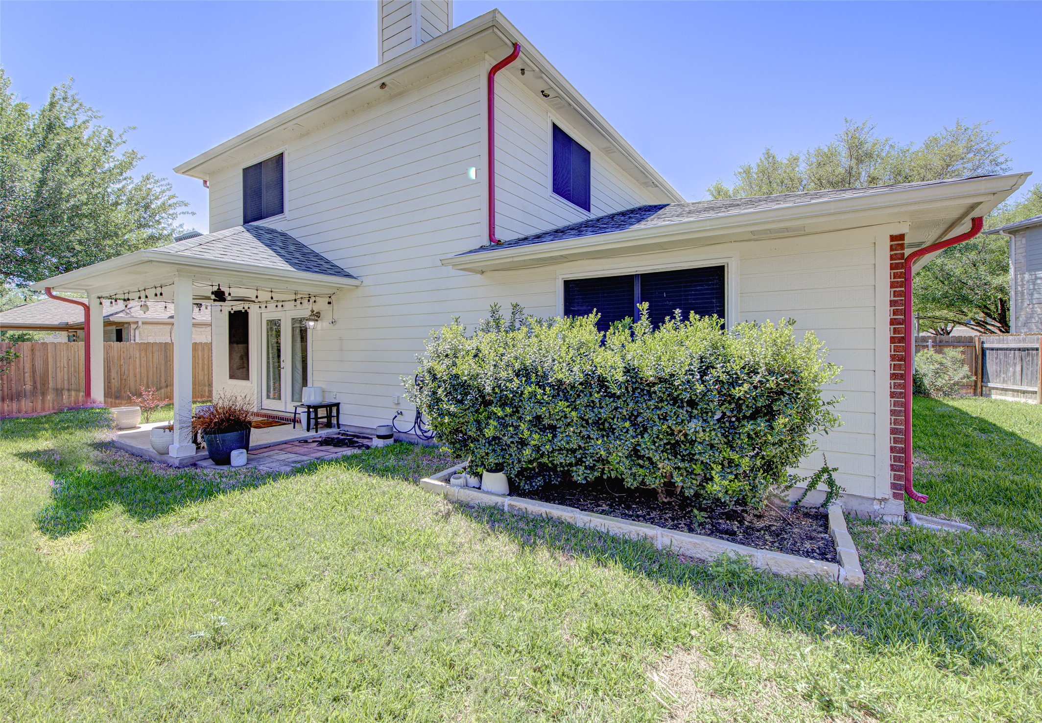 5908 Krinan Court Austin, TX 78754 - Photo 7 of 31 a front view of a house with a garden and trees