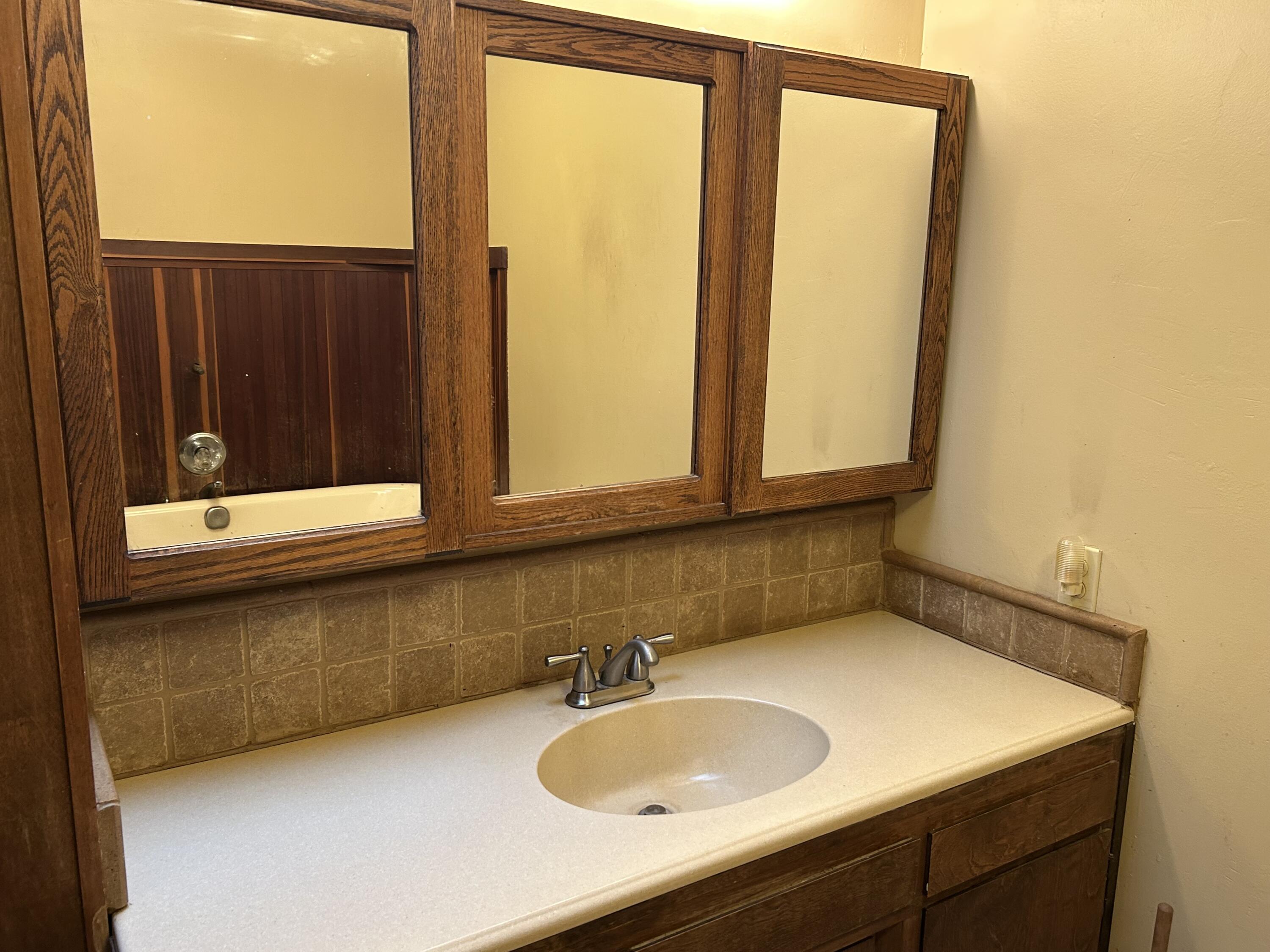 40838 Oak Ridge Drive Three Rivers, CA 93271 - Photo 21 of 51 a bathroom with a sink and a mirror