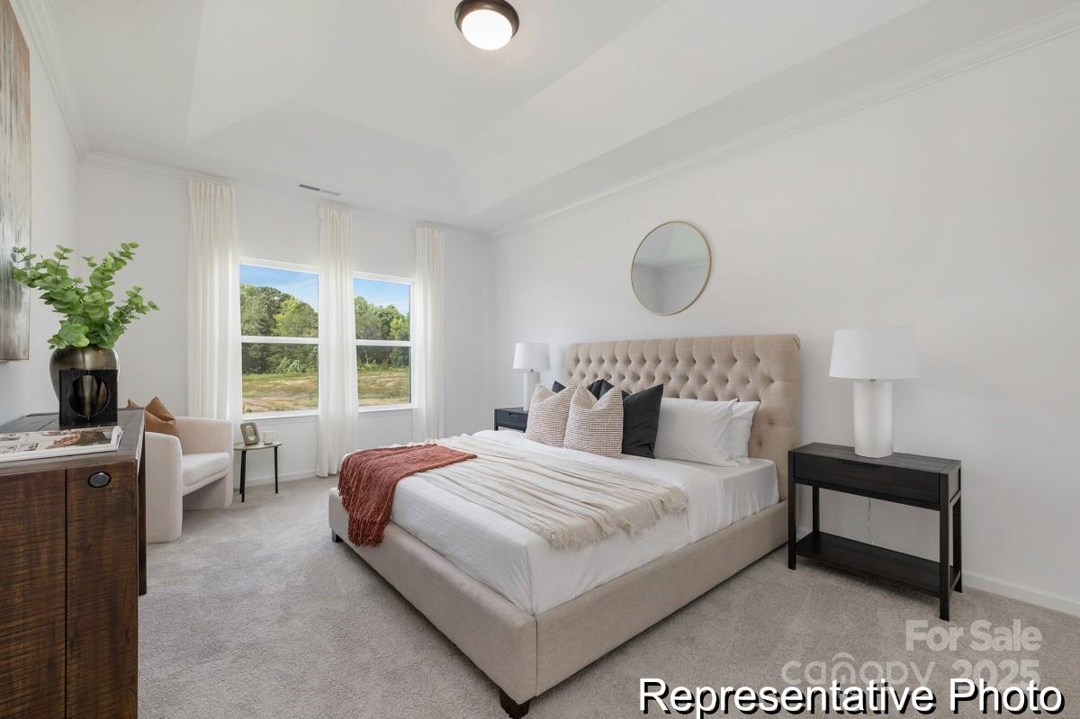 104 Soft Breeze Bend, Unit 160B Locust, NC 28097 - Photo 14 of 22 a bedroom with a bed and window