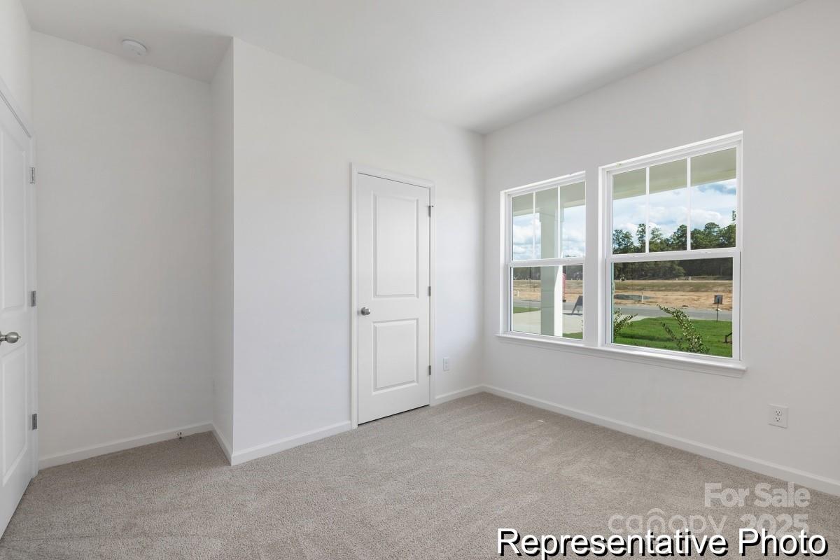 104 Soft Breeze Bend, Unit 160B Locust, NC 28097 - Photo 19 of 22 an empty room with windows