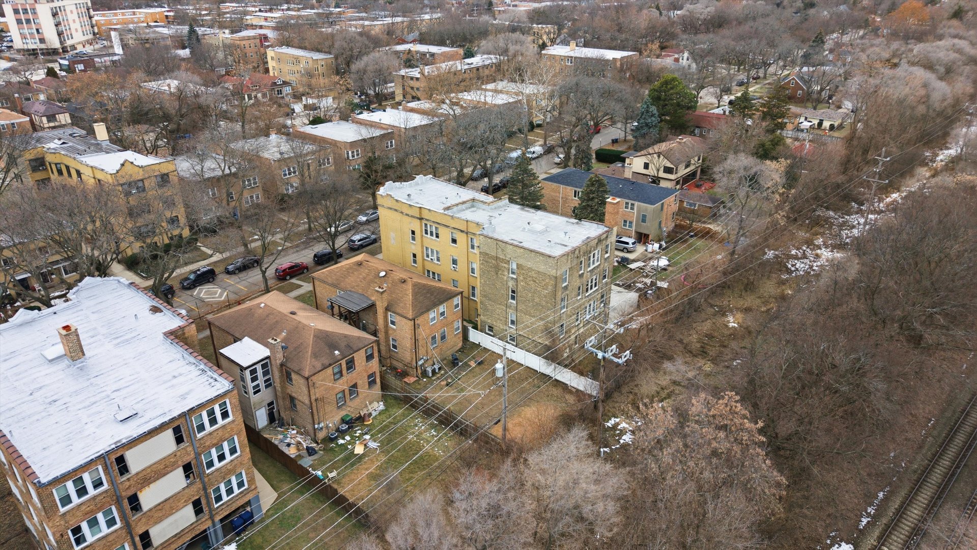 1321 Brummel Street Evanston, IL 60202 - Photo 13 of 14 an aerial view of a house with a yard and parking spaces