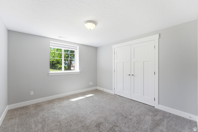 1614 Aspen Loop Provo, UT 84606 - Photo 18 of 47 Interior room with light gray walls and white trim