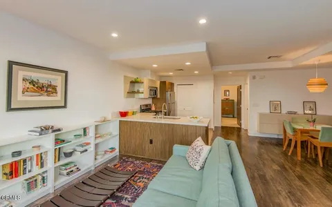 a living room with furniture and a table