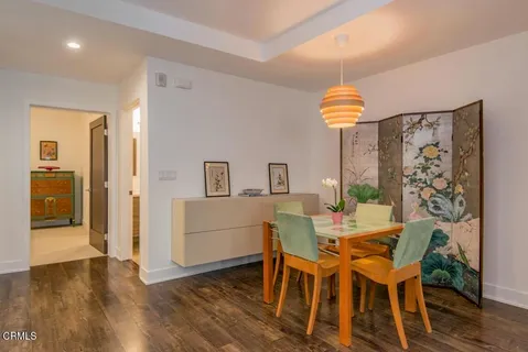 a view of a dining room with furniture and wooden floor
