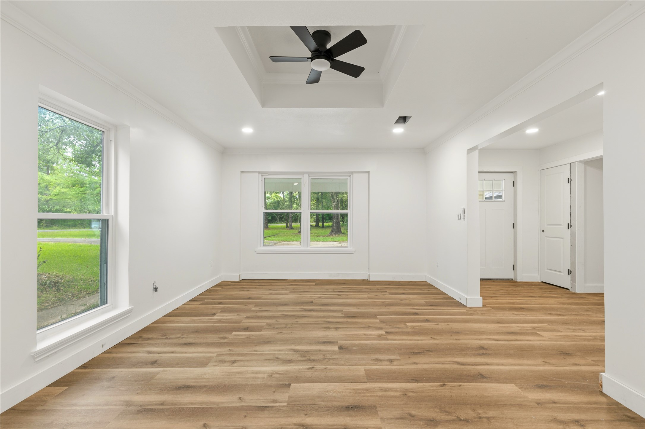 74 Robinson Road Huntsville, TX 77320 - Photo 17 of 33 a view of empty room with wooden floor and fan
