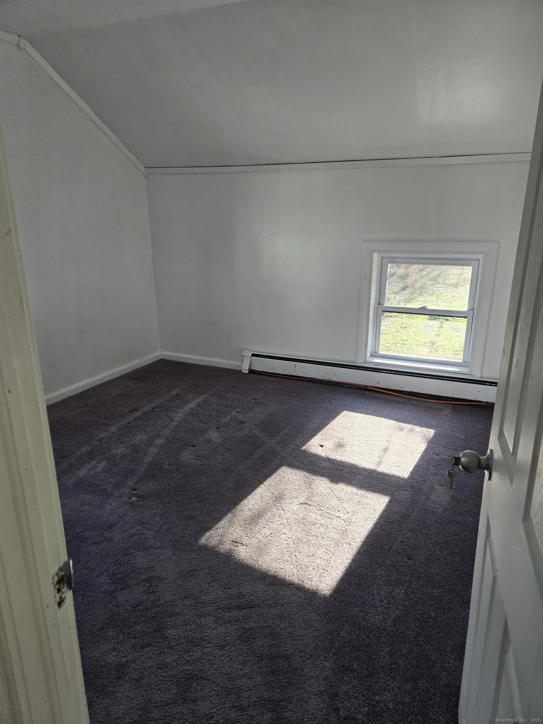 183 High Street Sprague, CT 06330 - Photo 2 of 10 view of an empty room and window