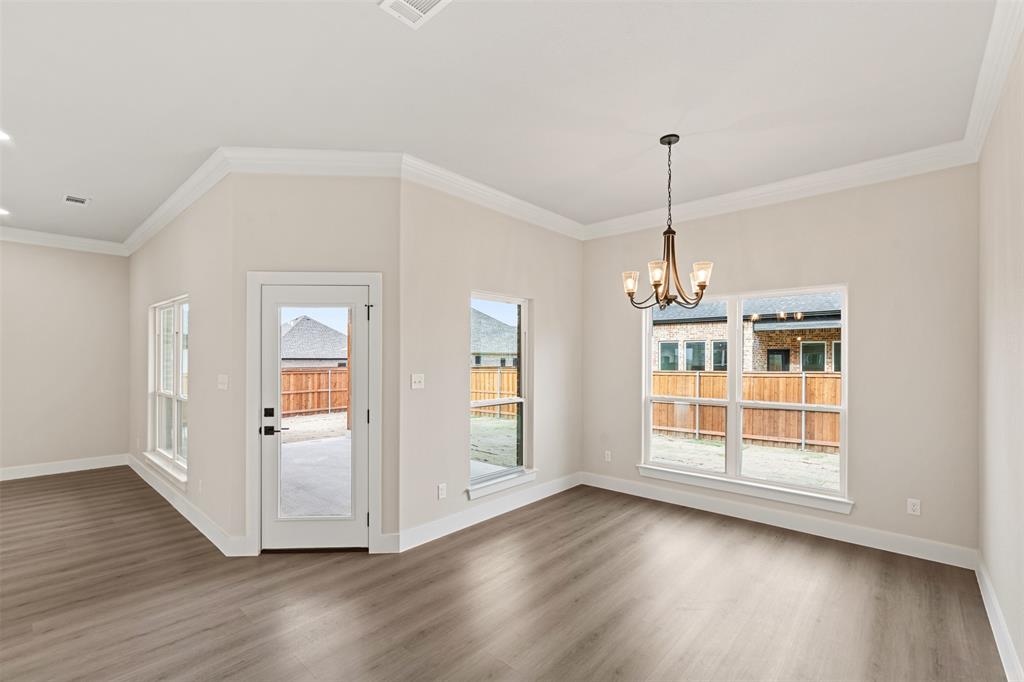 506 Limestone Circle Mabank, TX 75147 - Photo 11 of 33 a view of empty room with wooden floor and fan