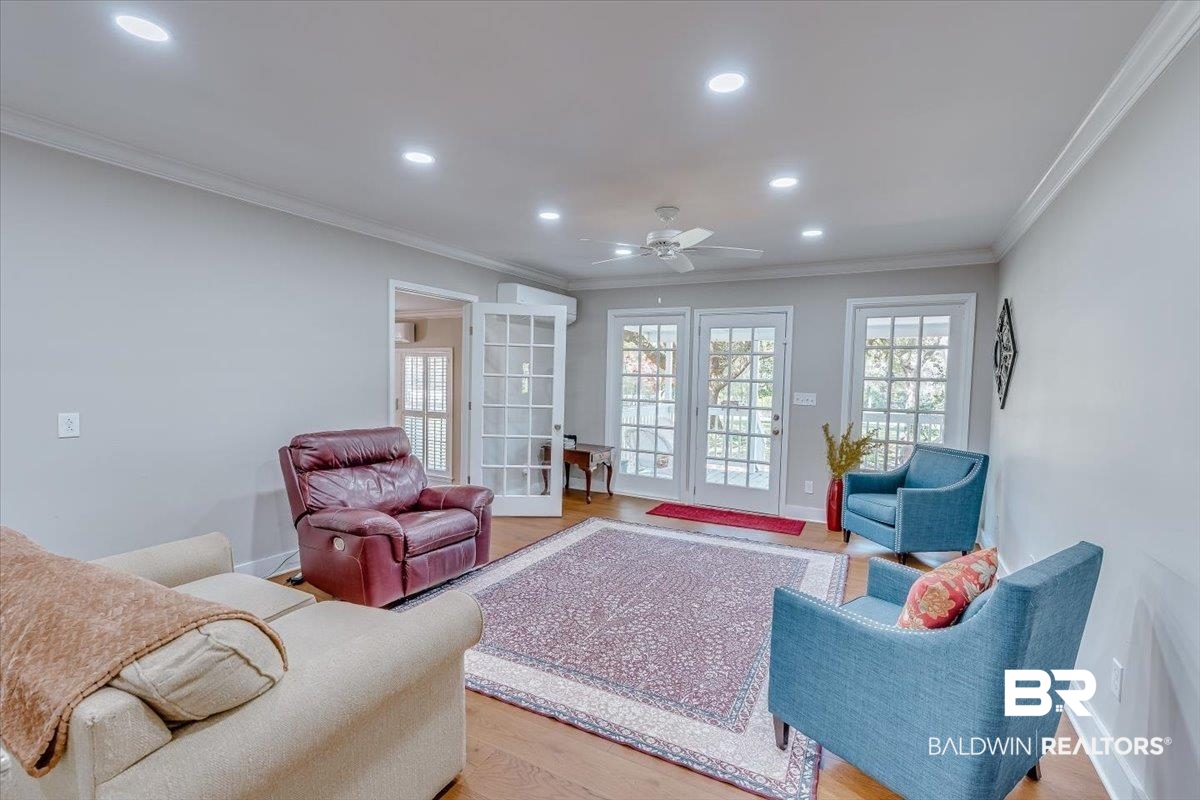 14160 Moffett Road Wilmer, AL 36587 - Photo 11 of 75 Living area with crown molding, recessed lighting, baseboards, light wood-style floors, and a ceiling fan