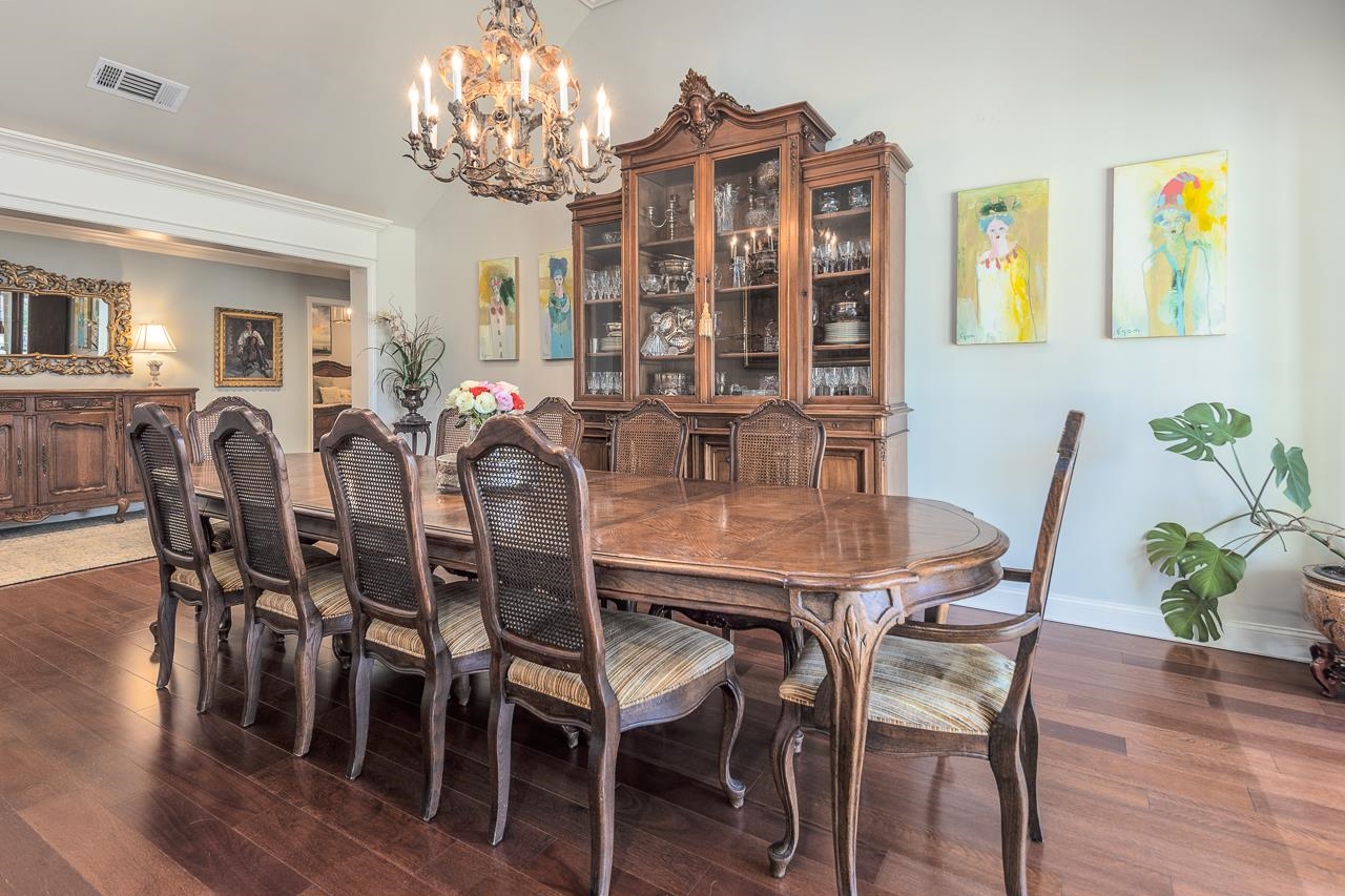 4723 Gwynne Road Memphis, TN 38117 - Photo 21 of 40 a view of a dining room with furniture and chandelier