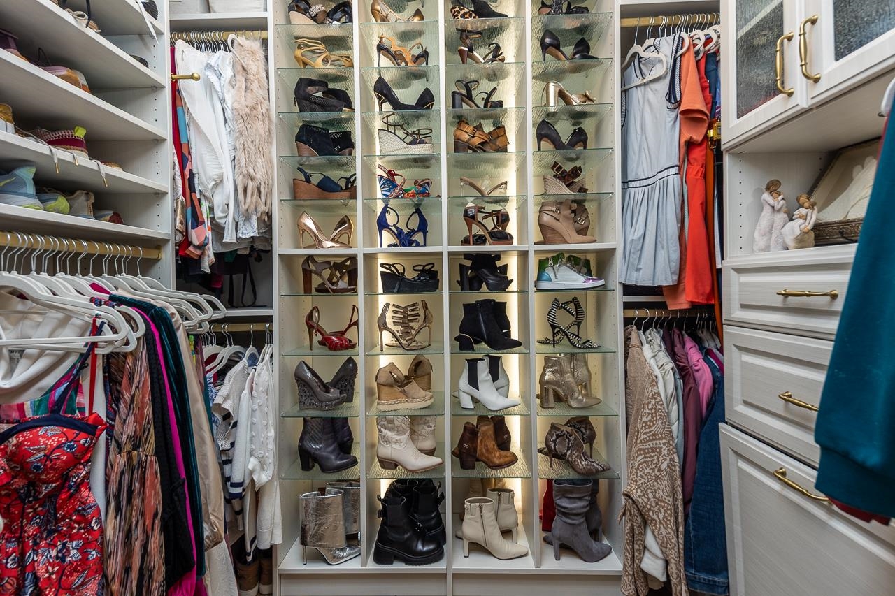 4723 Gwynne Road Memphis, TN 38117 - Photo 25 of 40 a view of walk in closet with clothes and shoes