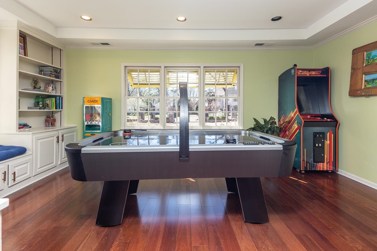 4723 Gwynne Road Memphis, TN 38117 - Photo 29 of 40 a room with wooden floors and large windows
