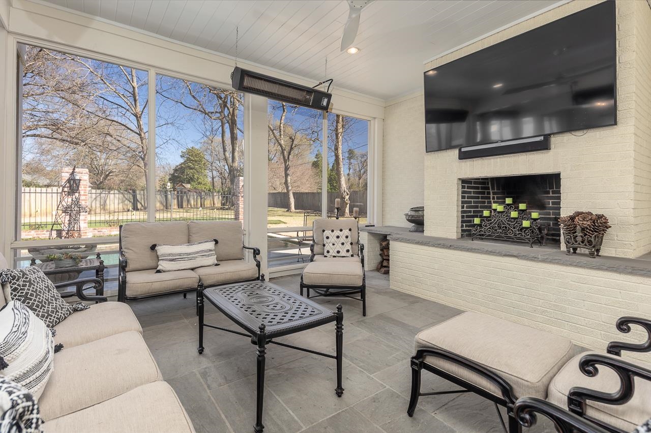 4723 Gwynne Road Memphis, TN 38117 - Photo 33 of 40 a living room with furniture and a fireplace