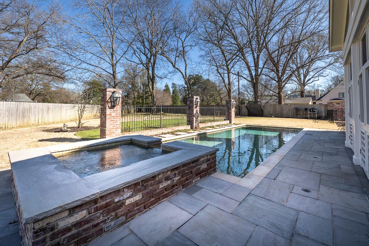 4723 Gwynne Road Memphis, TN 38117 - Photo 36 of 40 a swimming pool with outdoor seating and yard