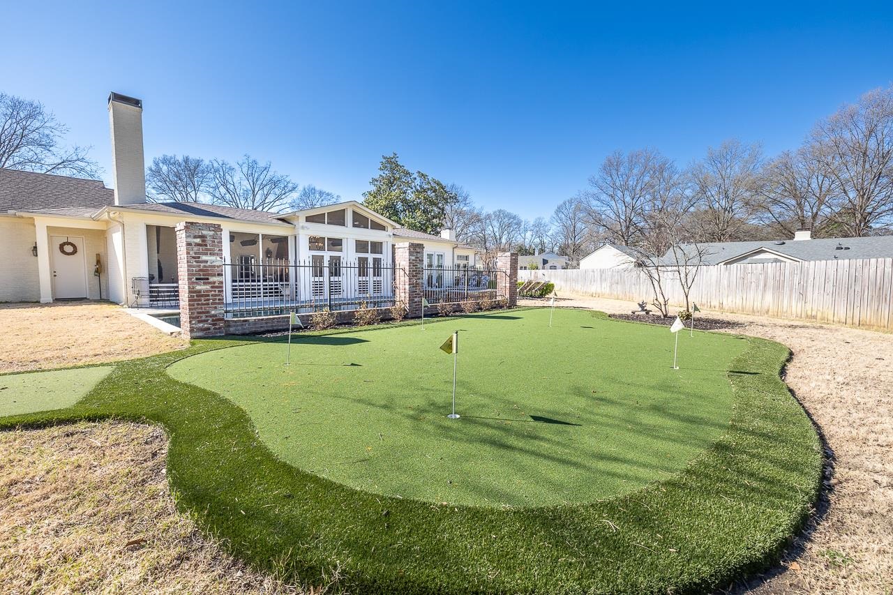 4723 Gwynne Road Memphis, TN 38117 - Photo 40 of 40 a view of a house with a backyard and a garden