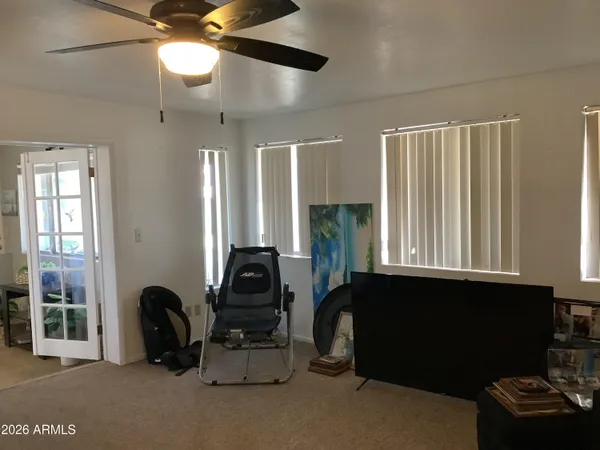 a dining room with furniture and window