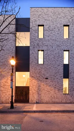 a brick building with a view of front door